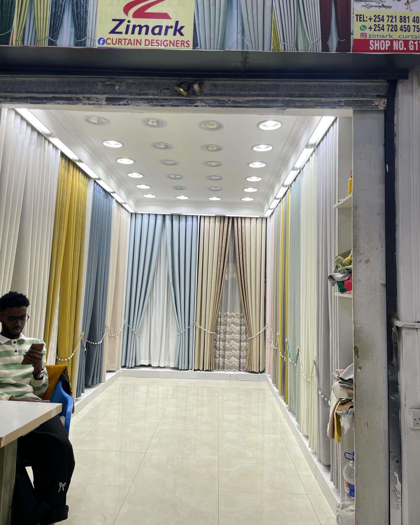 different colored curtains neatly arranged for display at Zimark Curtain shop in Nairobi..