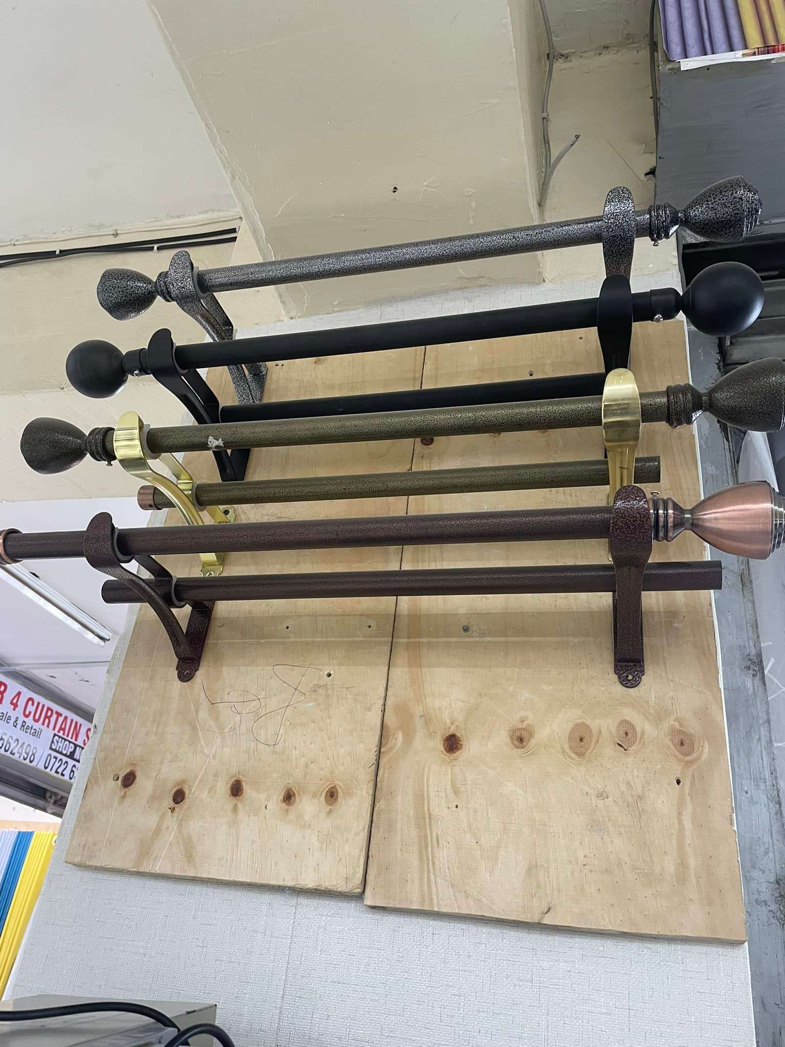 High-quality curtain rods in various finishes and sizes displayed at Zimark Curtain shop in Nairobi.